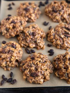 Baking sheet of healthy oatmeal raisin cookies.