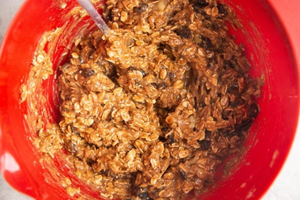 Oatmeal cookie dough in a mixing bowl.