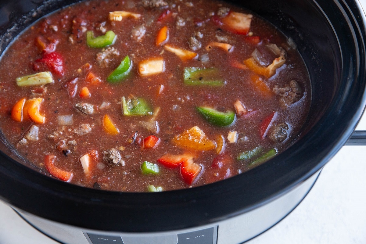 All of the ingredients for the soup in a crock pot.