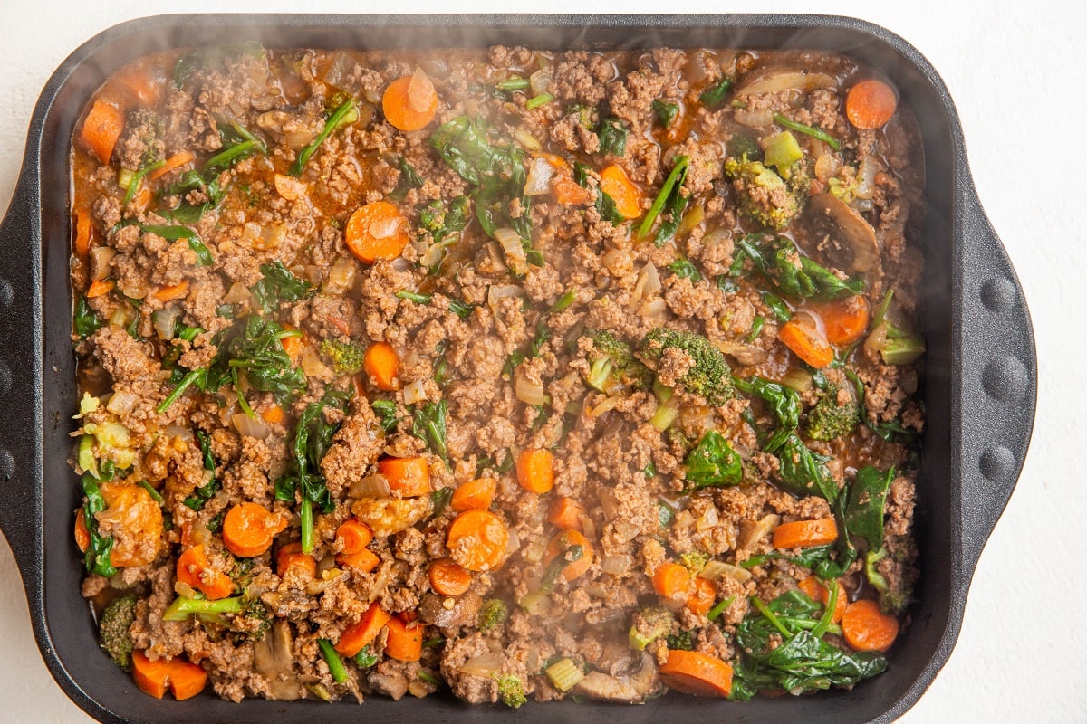 Meat mixture in a large casserole dish.