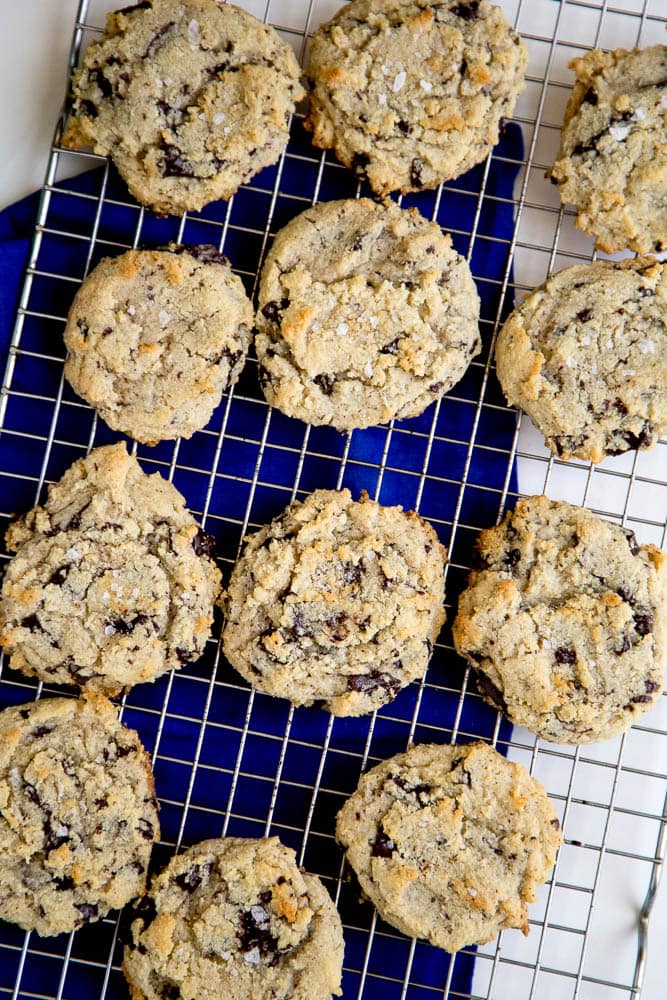 Chocolate chip cookies cooling on a cooling wrack.