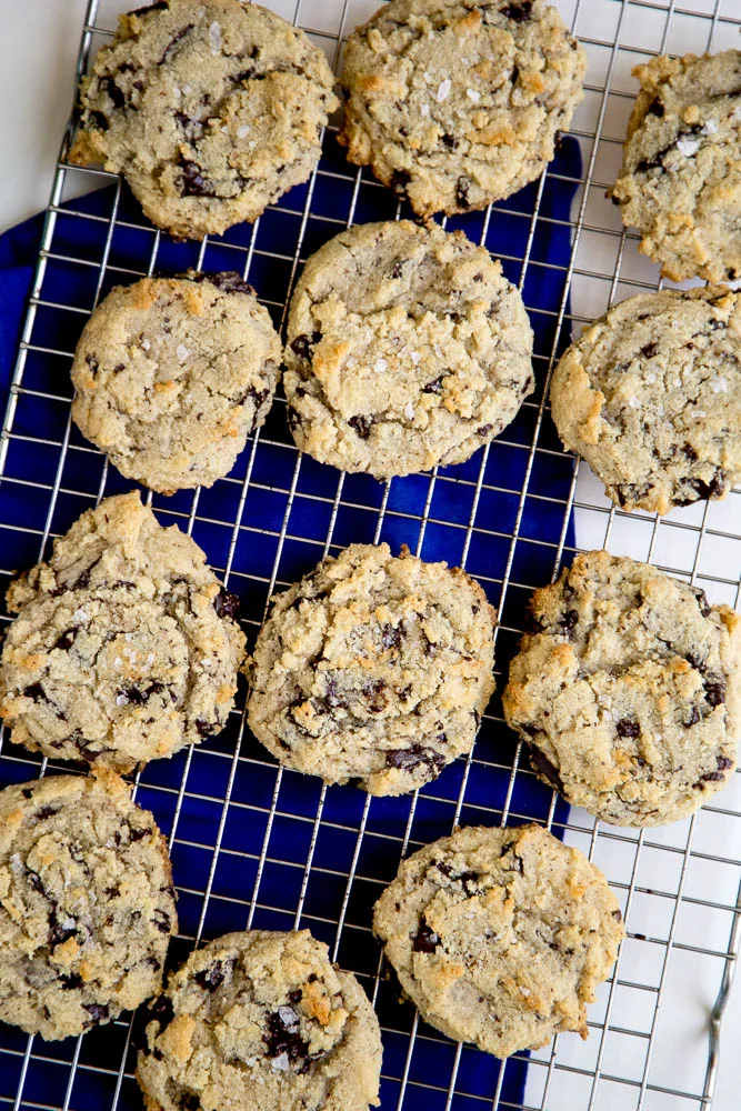 Chocolate chip cookies cooling on a cooling wrack.