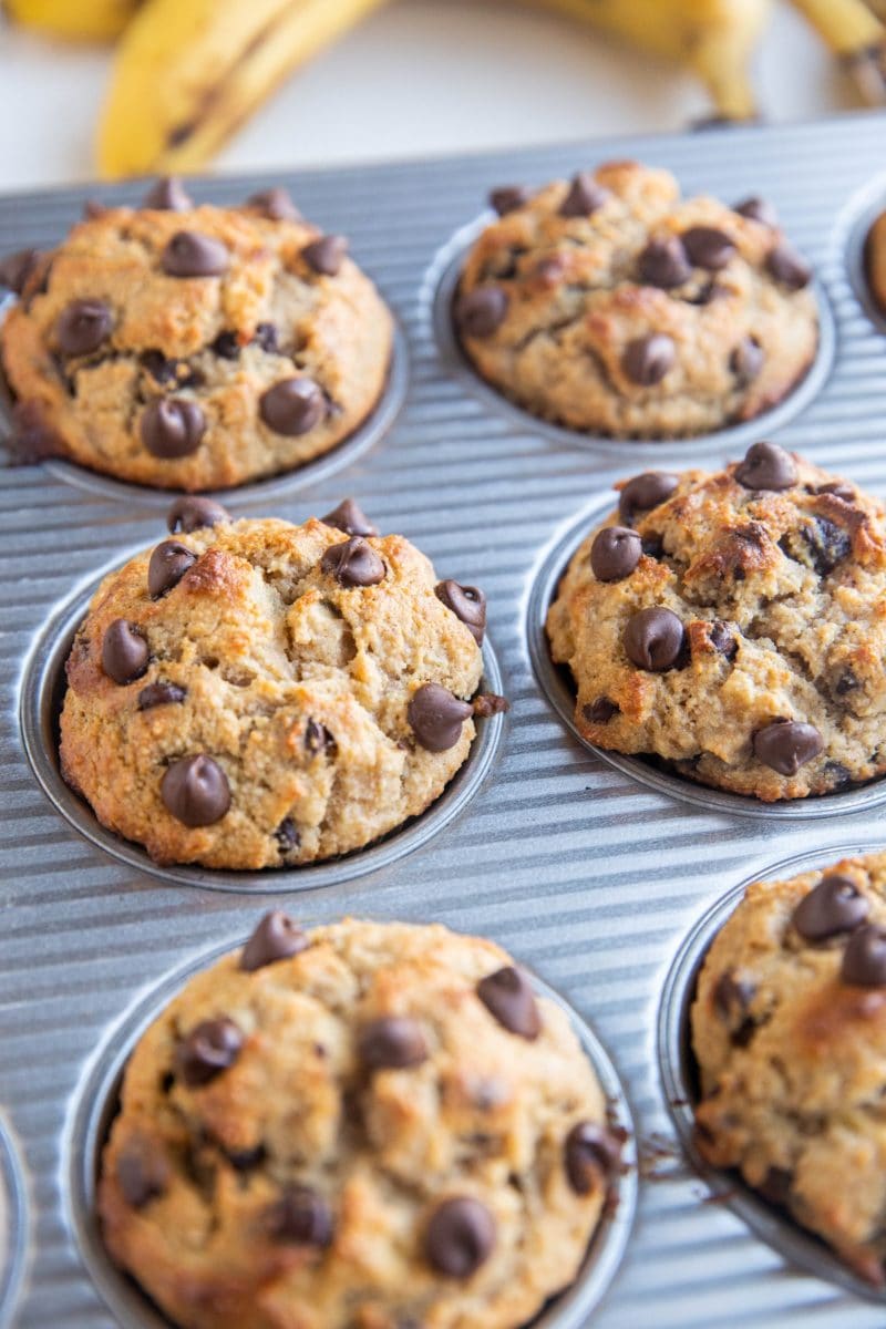 Muffin tray of finished almond flour muffins, fresh out of the oven.