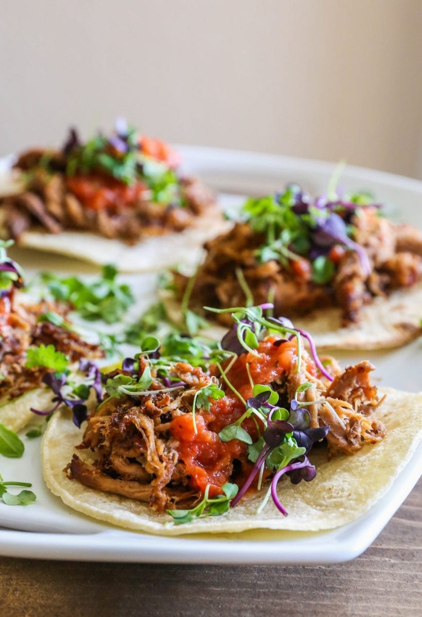 Barbacoa beef tacos on a serving platter