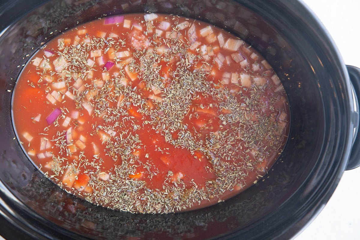 All of the ingredients for the soup in a crock pot.