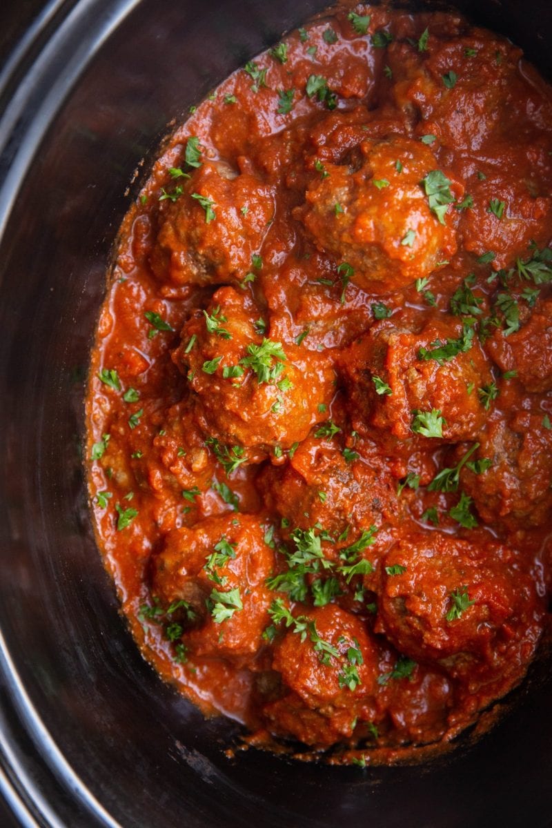 Finished meatballs in a slow cooker, ready to be served.