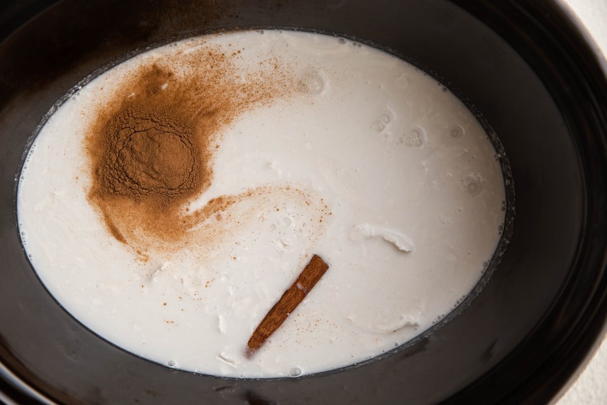 Rice, coconut milk, cinnamon, salt, and cinnamon stick in a crock pot.