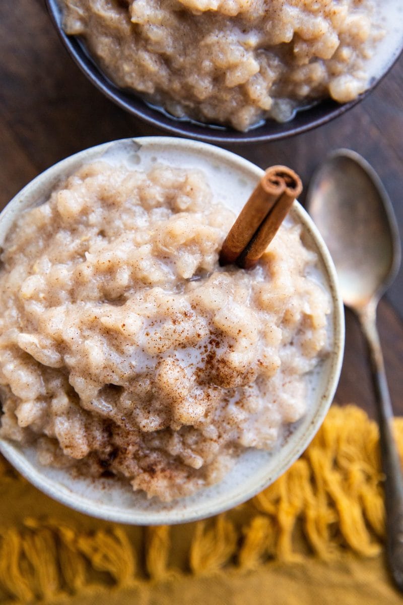 Top down image of two bowls of rice pudding.