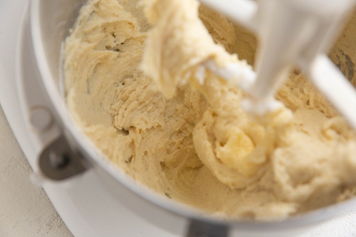 Coffee cake batter in a stand mixer, ready to be baked.