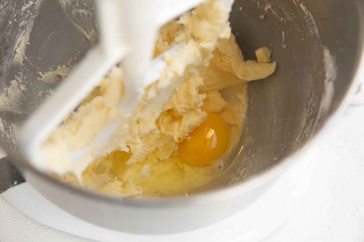 Creamy butter and sugar in a stand mixer with an egg added in to be beaten into the dough.