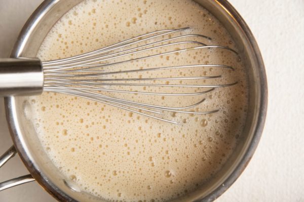 Custard mixture in a saucepan for bread pudding