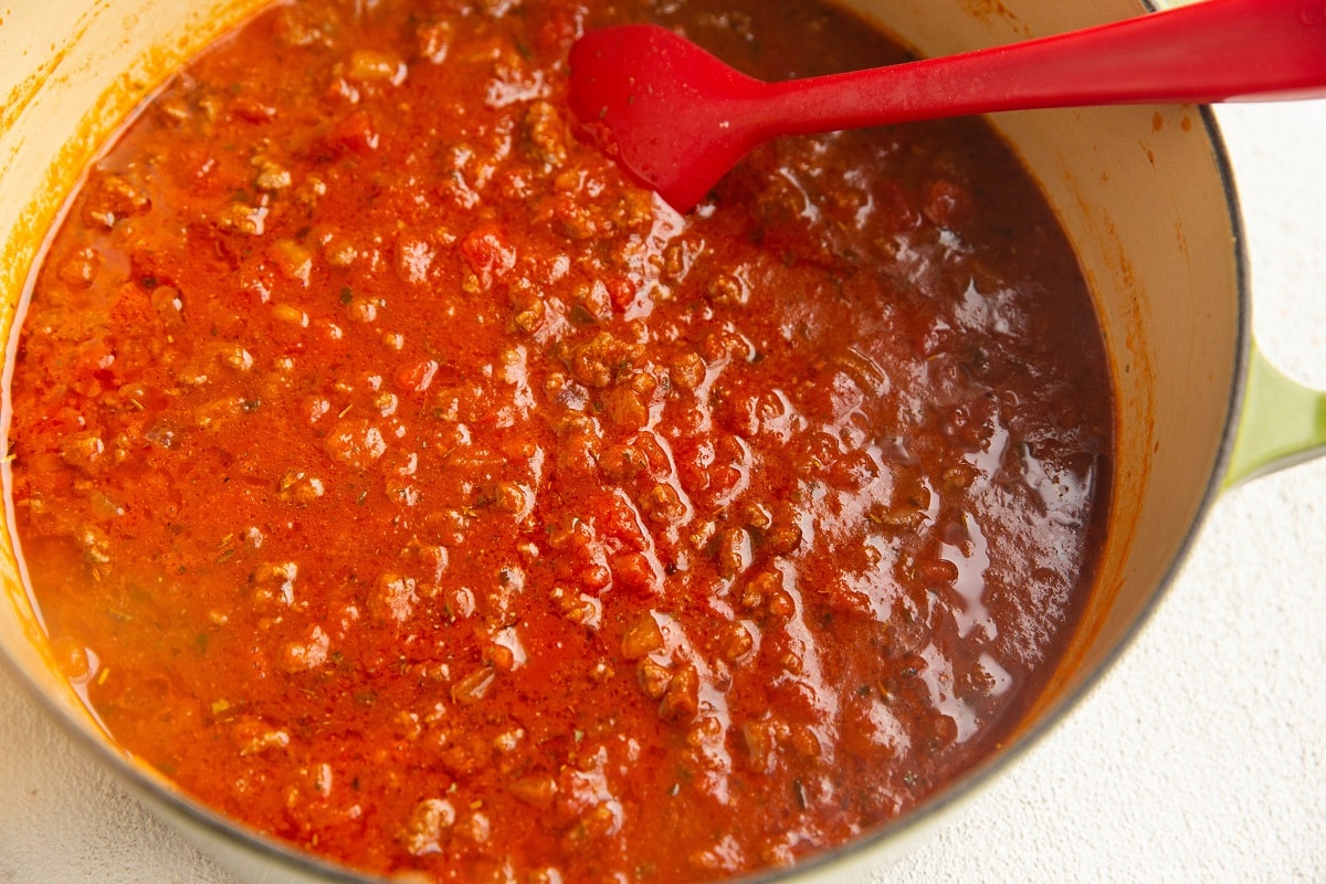 Finished meat sauce in a large pot for lasagna.