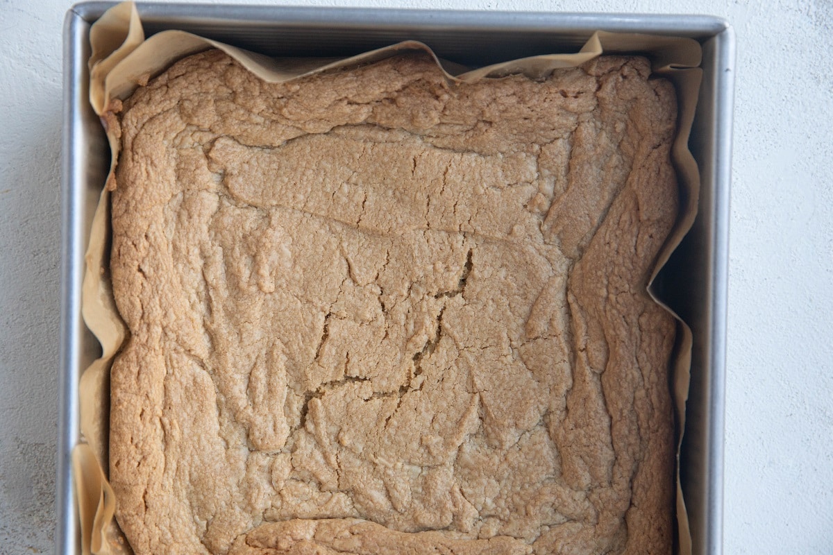 Peanut butter cookie bars in a baking pan.