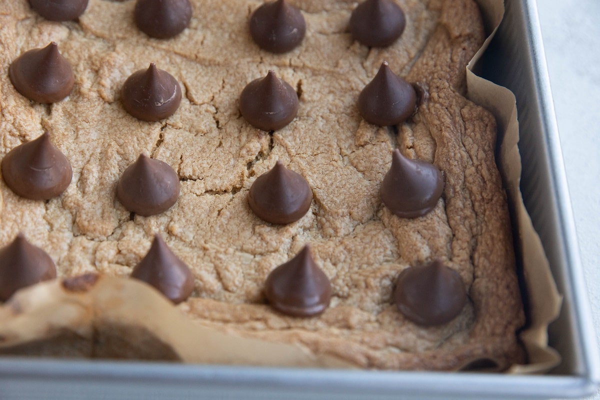 Peanut butter cookie bars with chocolate kisses on top.