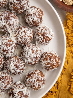 Top down plate of coconut chocolate snowballs.