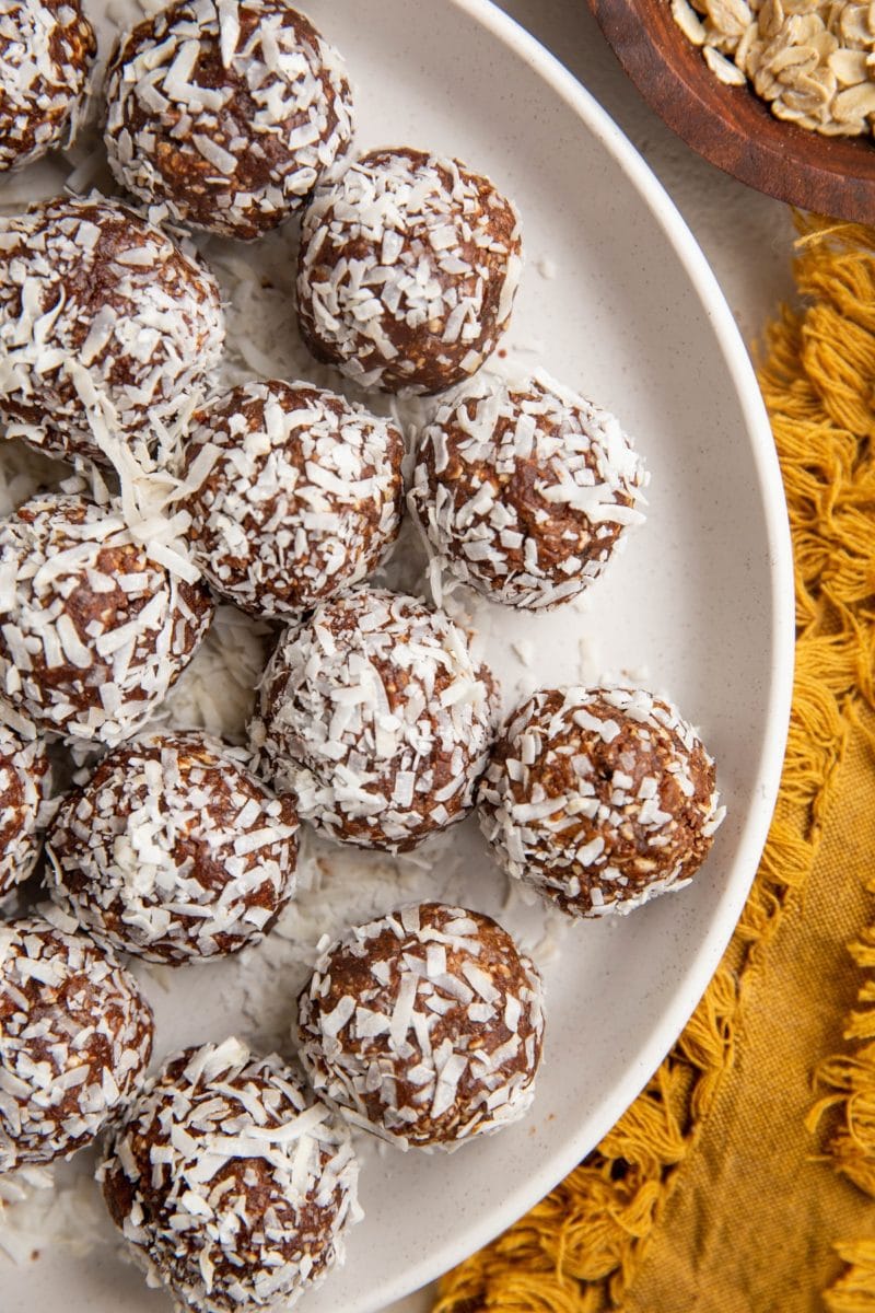 Top down plate of coconut chocolate snowballs.