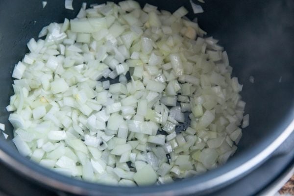 Yellow onions sautéing in an Instant Pot