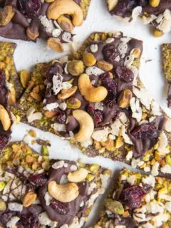 Top down photo of chocolate bark broken into chunks on a white backdrop.