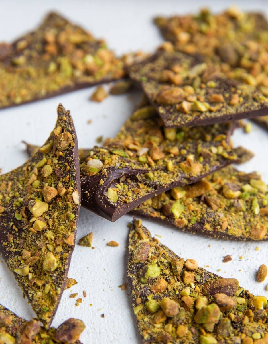 Pistachio Bark chunks laying on a white background.