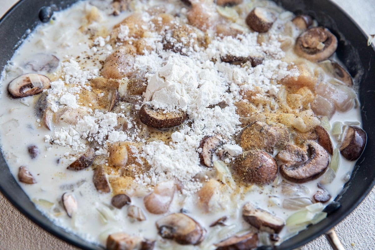 Onion, mushroom, chicken, coconut milk, flour, pepper, and salt in a large skillet.