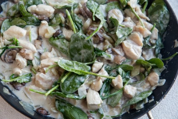 Creamy chicken mushroom and spinach sauce for the casserole.