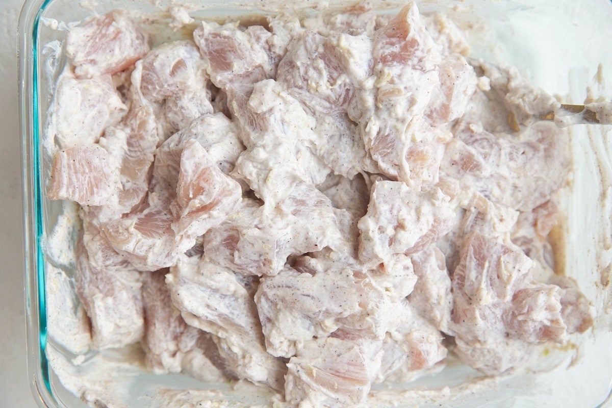 Chicken marinating in yogurt and spices