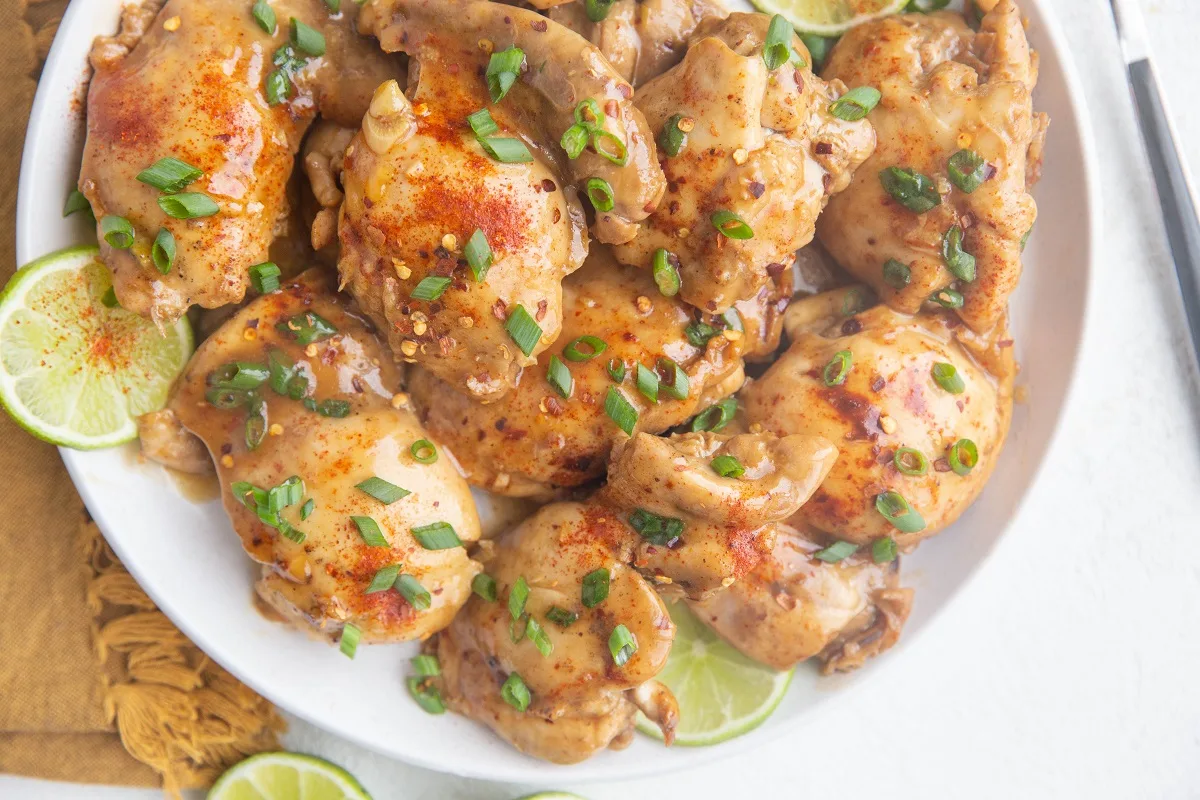 Horizontal image of a plate of Asian Instant Pot Chicken Thighs.