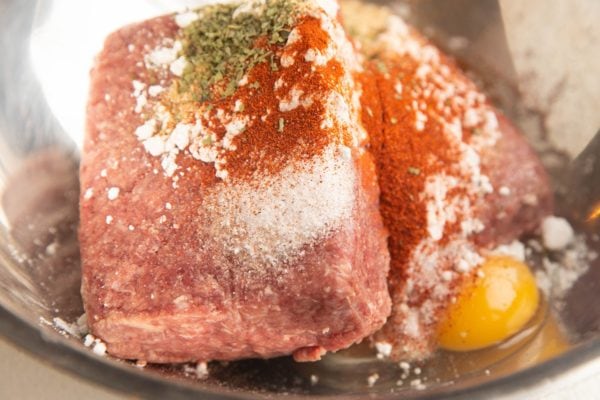 Meatball ingredients in a mixing bowl, ready to be mixed to make meatballs