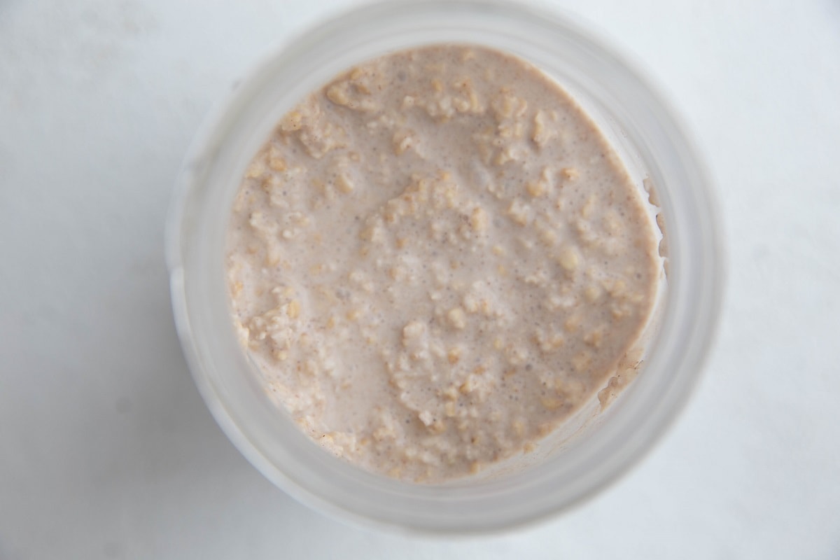 Top down photo of a jar of Chai overnight oats, ready to eat.