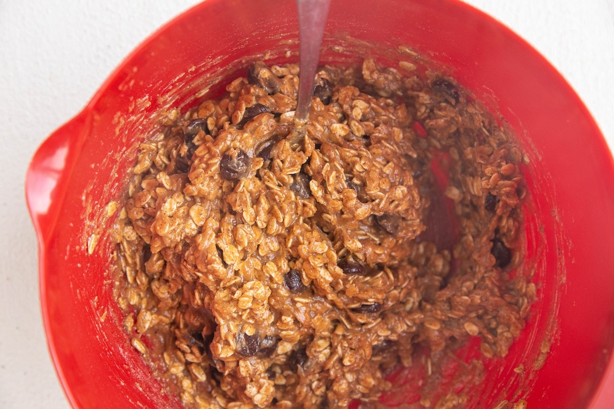 Almond butter oatmeal cookie bar dough in a mixing bowl, ready to be baked.