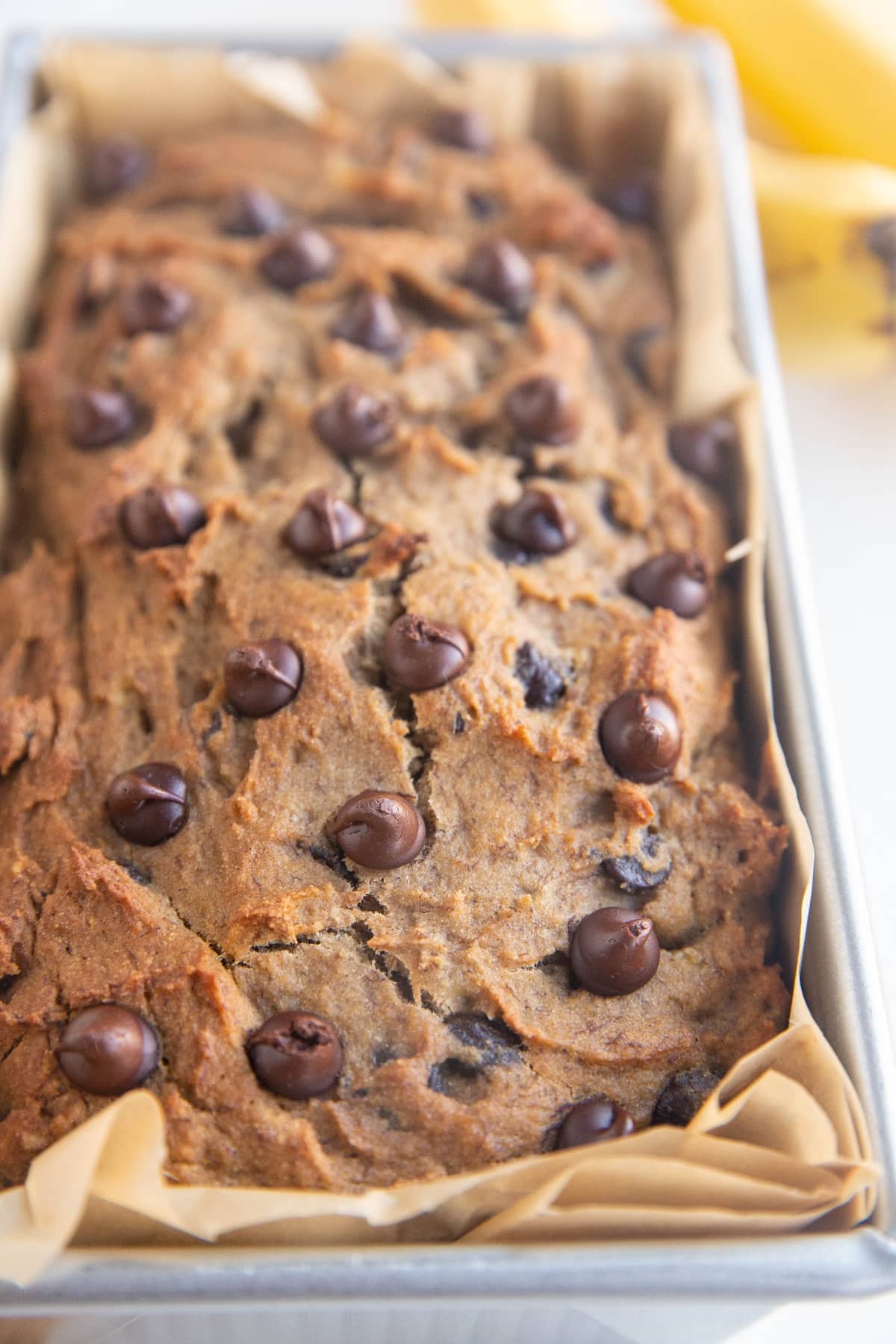 Cassava flour banana loaf in a loaf pan, fresh out of the oven.