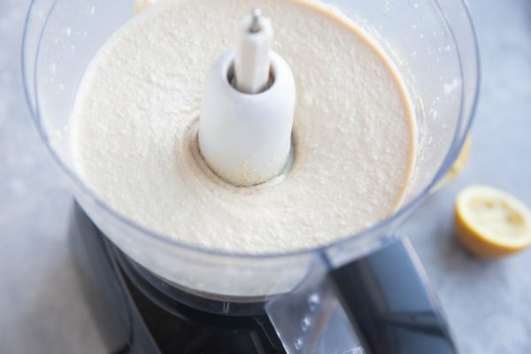 Creamy hummus in a food processor, ready to serve.