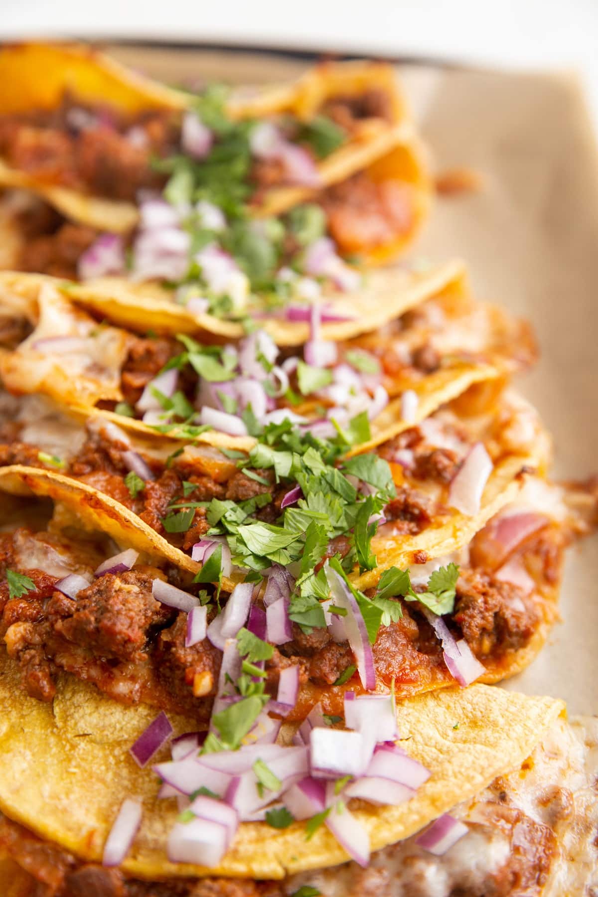 Crunchy ground beef tacos on a serving tray, ready to serve.