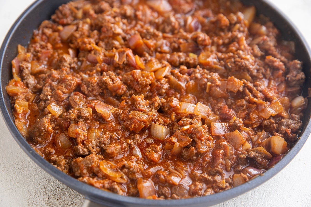 Skillet with ground beef taco meat, ready to be made into tacos.