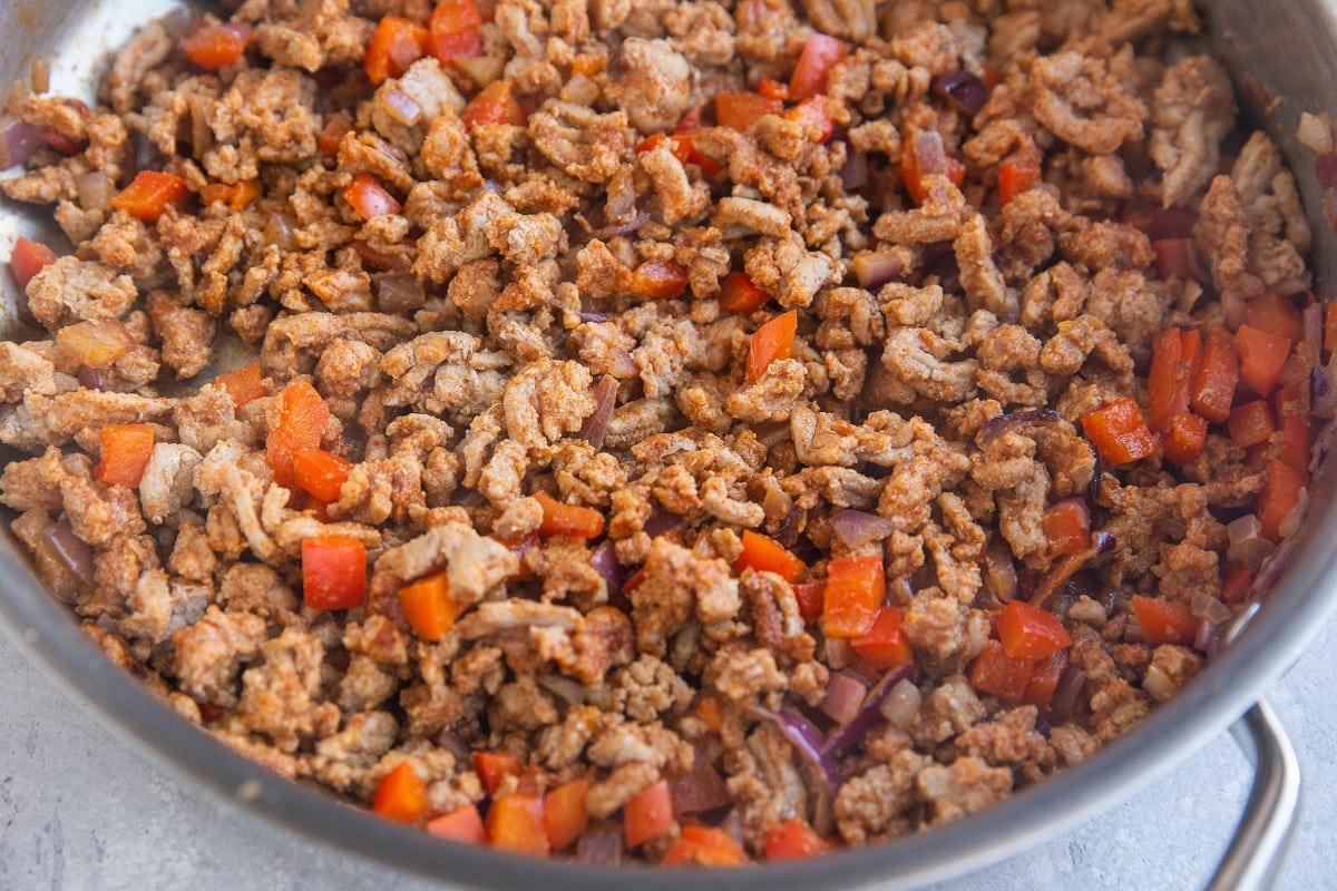 Skillet with ground turkey taco meat inside.