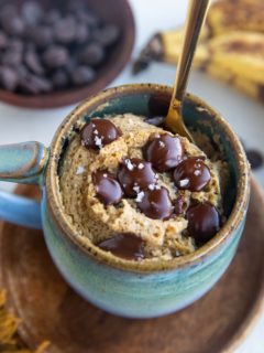 Mug cake with a spoon inside, ready to eat.