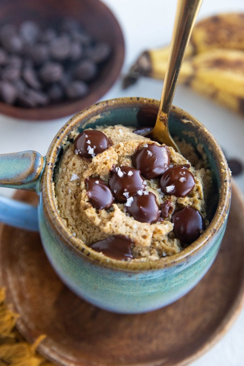 Mug cake with a spoon inside, ready to eat.