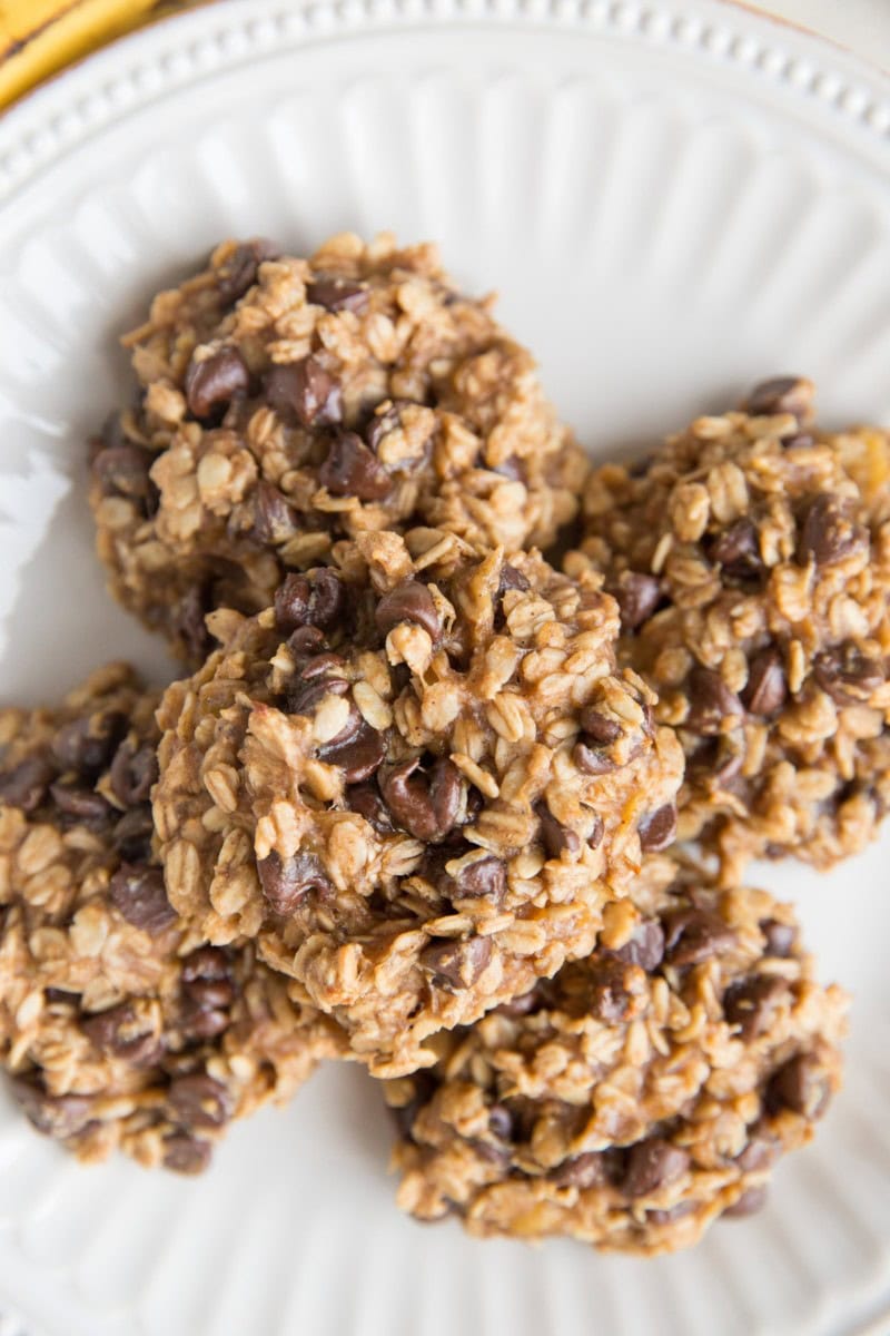 3-Ingredient Oatmeal Cookies with chocolate chips on a white plate, ready to eat, fresh out of the oven.