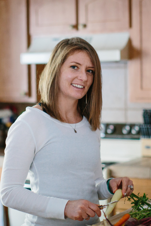 Julia Mueller peeling carrots in a kitchen