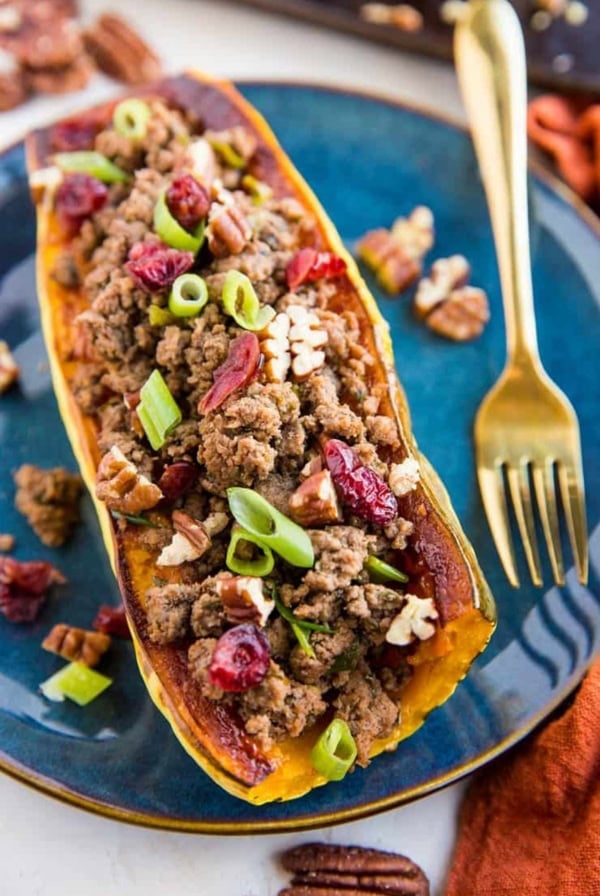Stuffed Delicata Squash with Ground Beef, Cranberries and Pecans is a healthy dinner recipe that is paleo, whole30 and nutritious. Plus, it's easy to make!