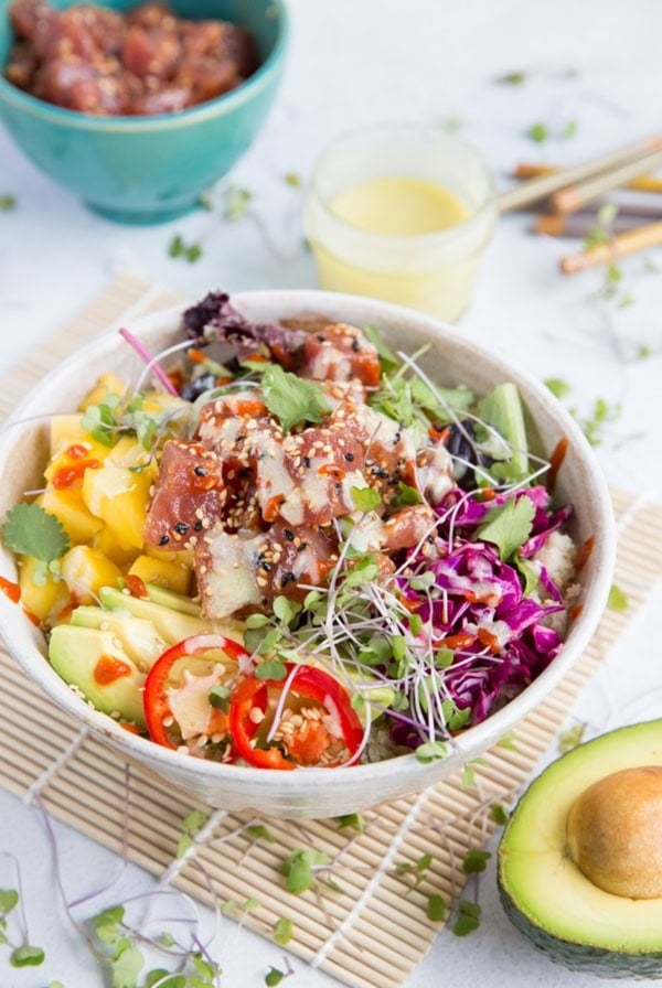 Ahi Poke Sushi Bowls with Wasabi Mayo, mango, avocado, microgreens, rice, and more.
