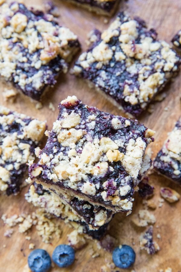 Blueberry crumb bars stacked on top of each other.