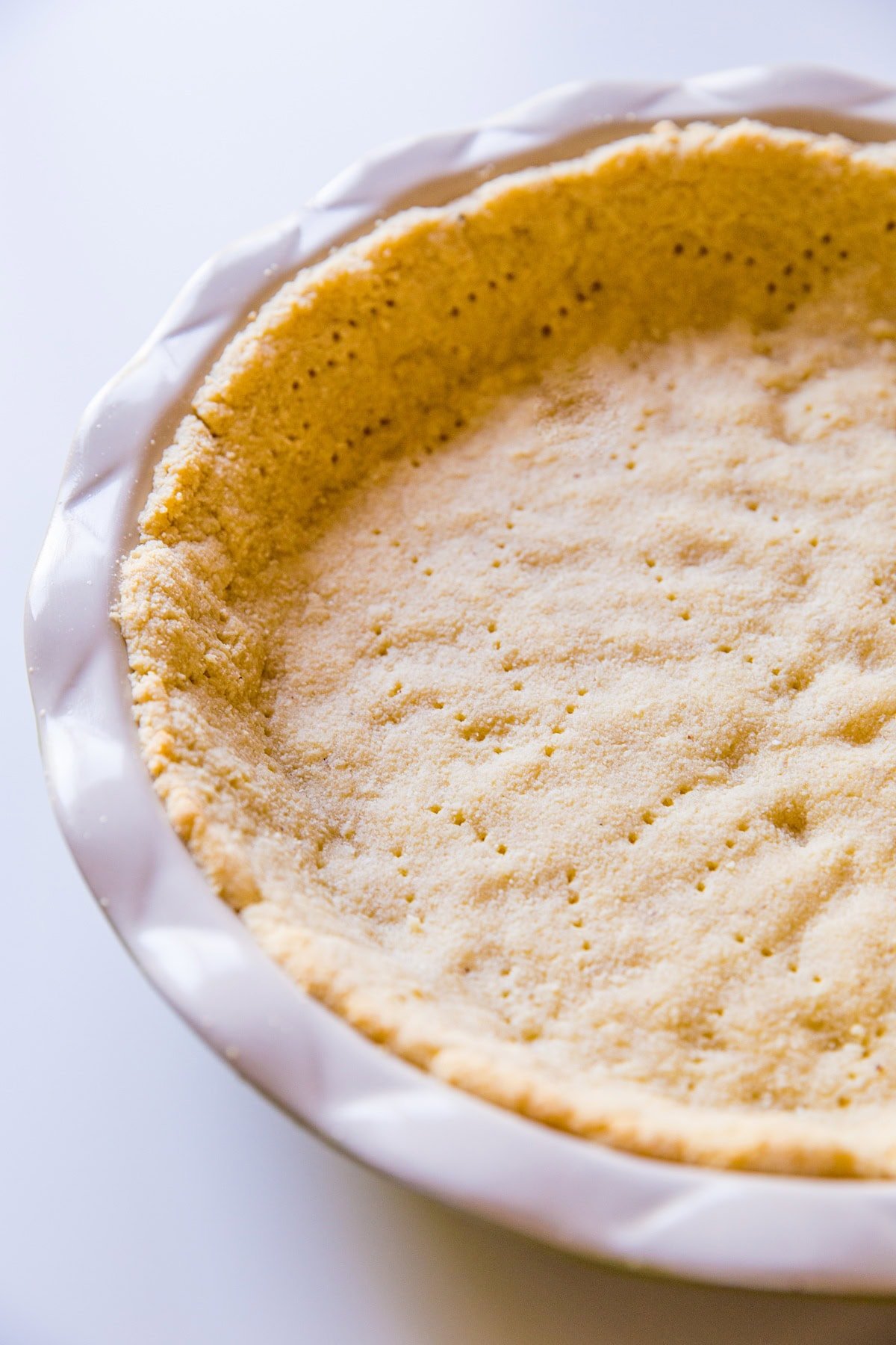 Almond flour pie crust fresh out of the oven and ready to use. An easy sugar free pie crust recipe