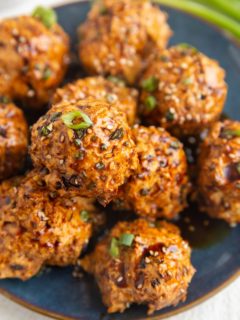 Blue plate of ground turkey meatballs, ready to serve.