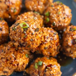 Blue plate of ground turkey meatballs, ready to serve.