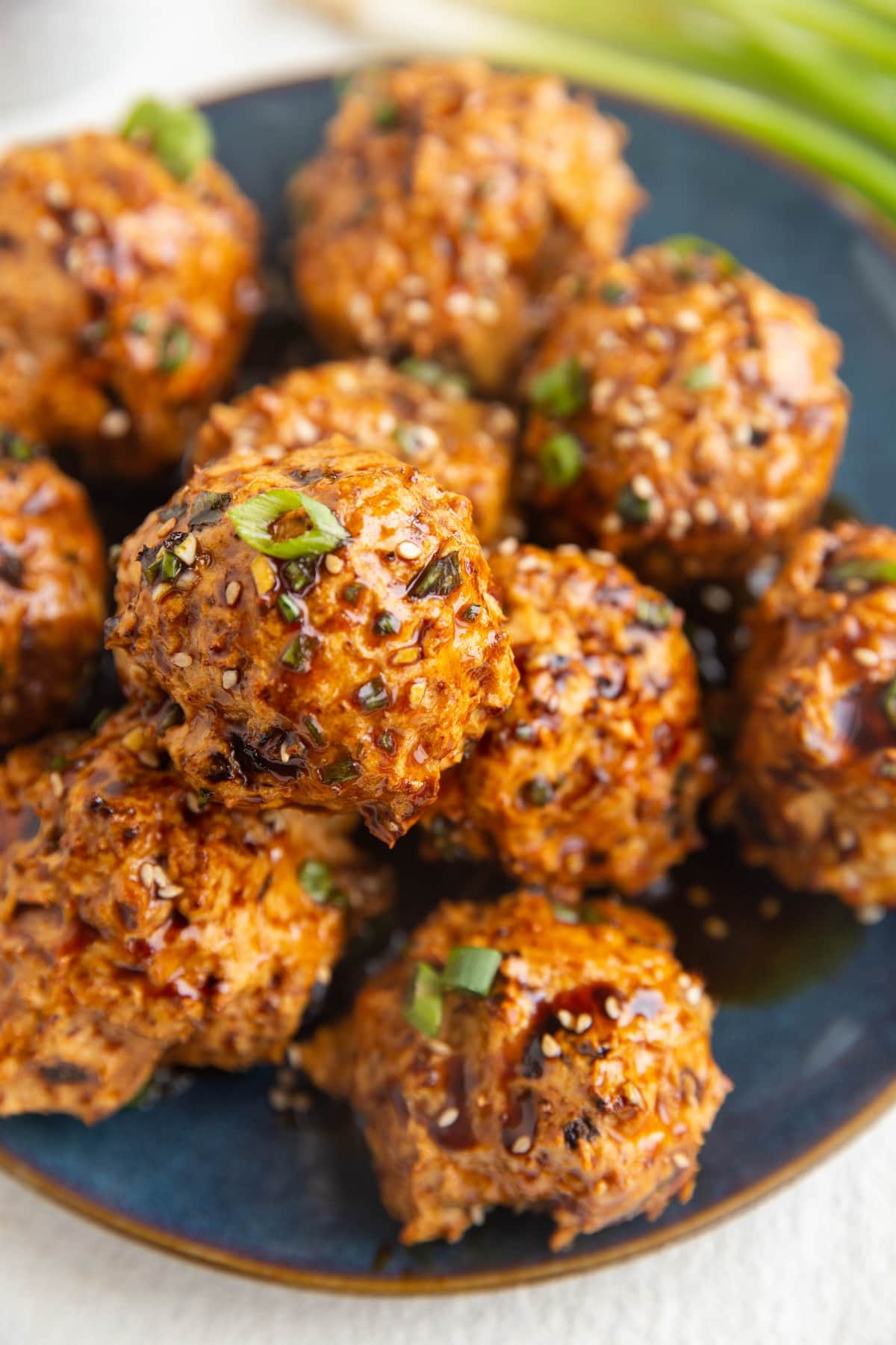 Blue plate of ground turkey meatballs, ready to serve.