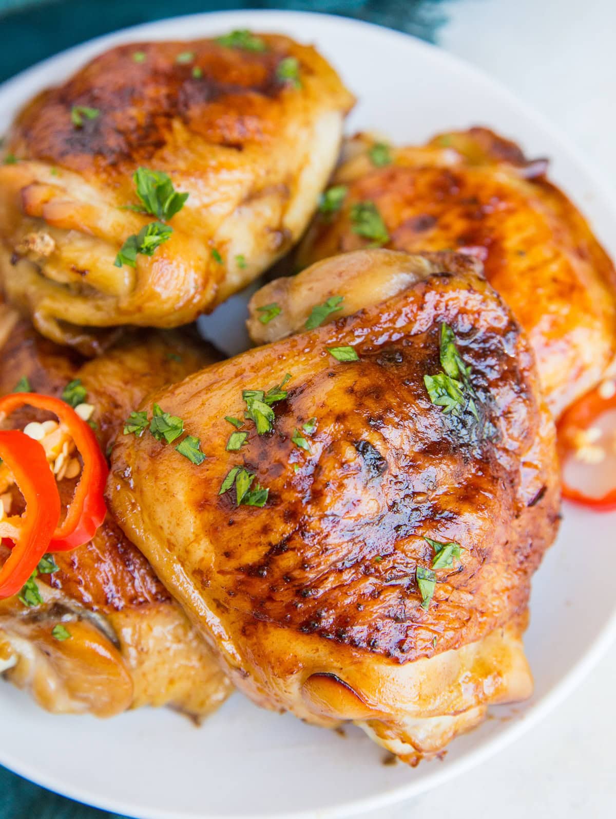 Teriyaki Chicken baked in the oven on a plate, ready to serve.