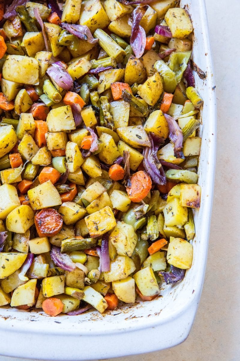 Balsamic roasted vegetables in a white casserole dish, fresh out of the oven and ready to serve.