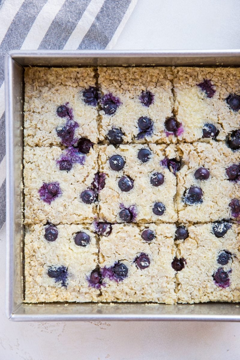 Baking dish with sliced blueberry baked oatmeal, ready to eat.