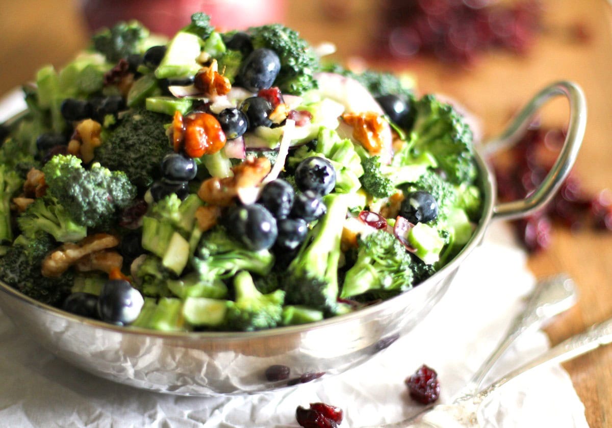 Big bowl of broccoli salad with honey toasted walnuts.